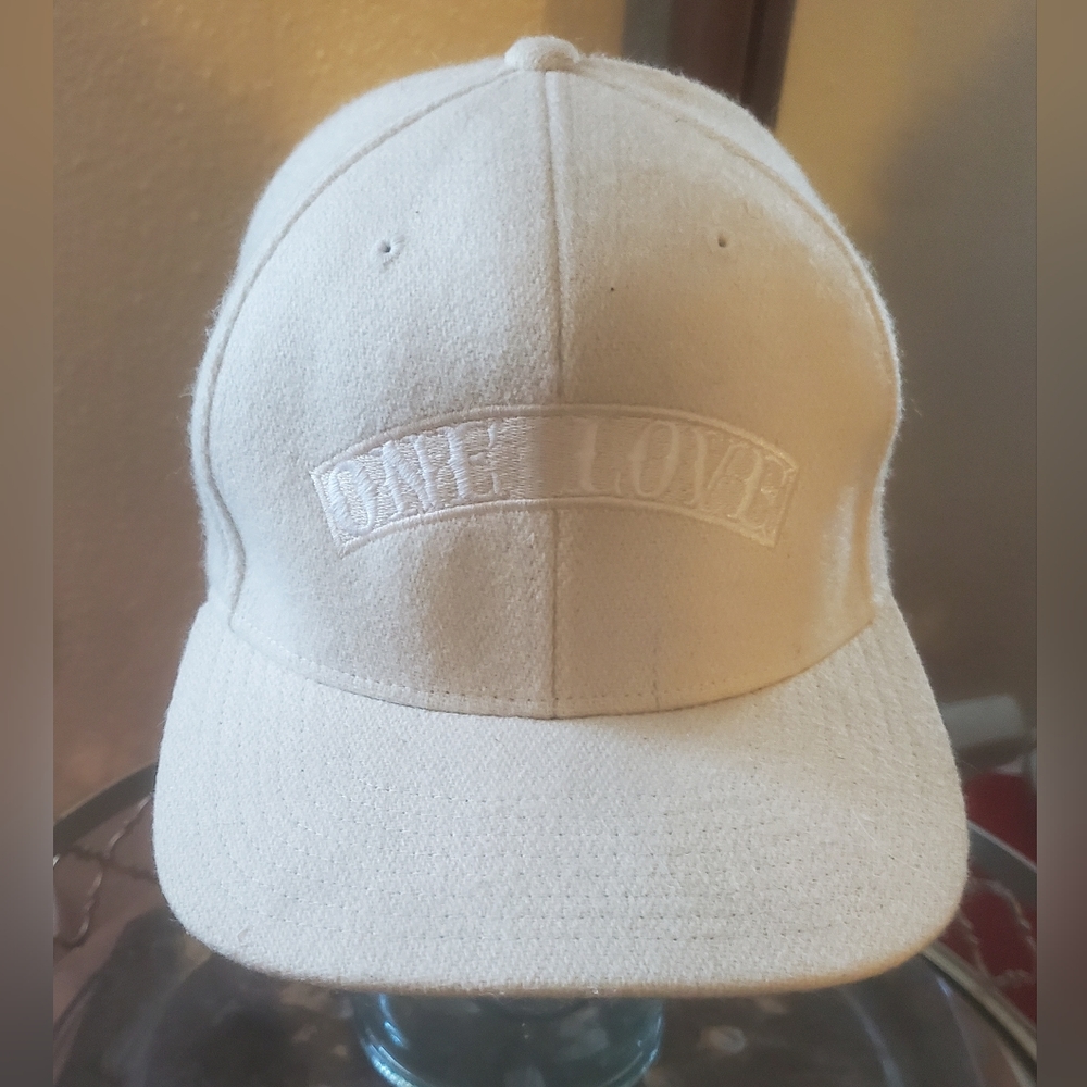 The Classics Embroidered ONE LOVE Premium Wool Snapback Cap.